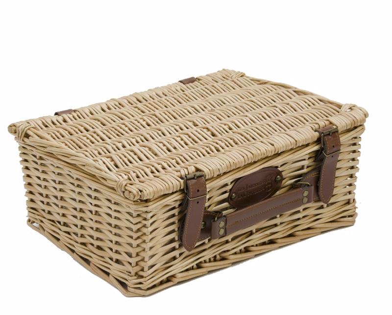 Empty wicker basket with cream fabric