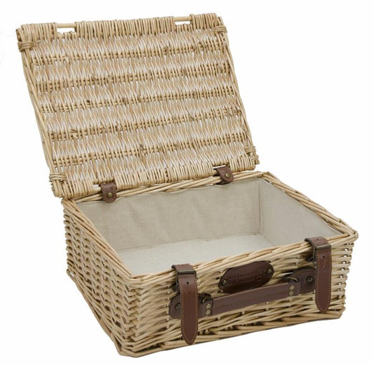 Empty wicker basket with cream fabric